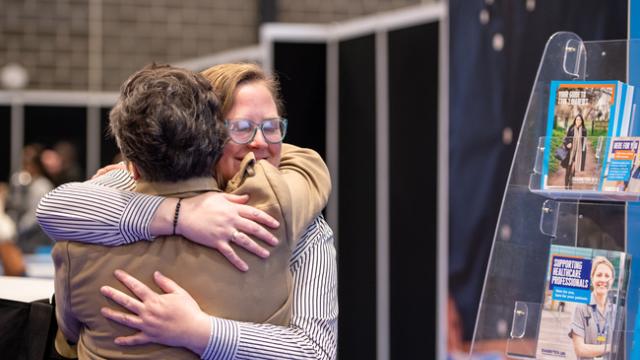 Two people hugging at a Diabetes UK event