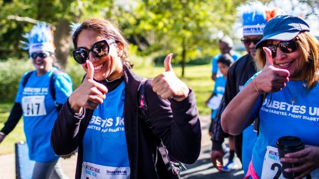 Fundraisers giving a thumbs up