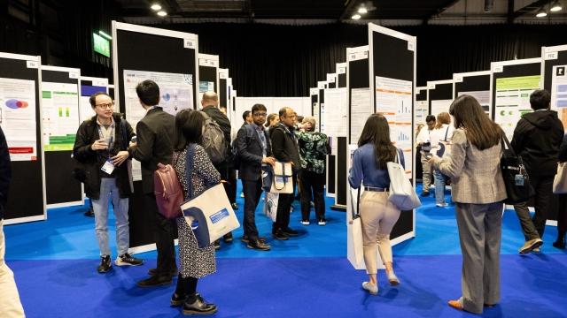 Delegates looking at abstract submissions at Diabetes UK Professional Conference