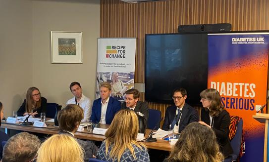 Five people on a panel discussing children's health at party conferences