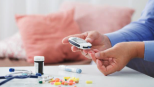 lady checking her diabetes